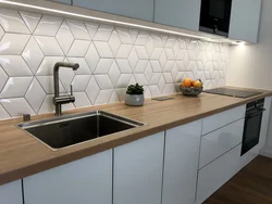 Tiling the kitchen wall photo