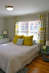 Yellow curtains in the bedroom interior photo