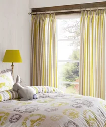 Yellow curtains in the bedroom interior photo