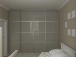 Wall-to-wall wardrobe in the bedroom photo with a view