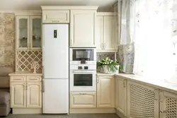 Interior design of kitchen with white refrigerator