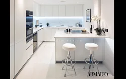 White kitchen design with breakfast bar