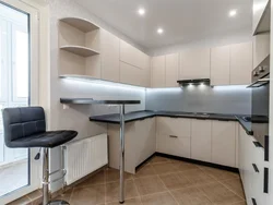 White kitchen design with breakfast bar