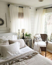 White walls in a bedroom interior with curtains