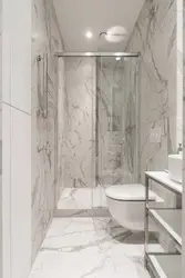 Bathroom design with shower and toilet in marble