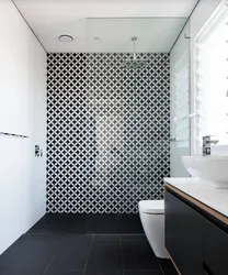 Black mosaic tiles in the bathroom photo