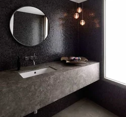 Black mosaic tiles in the bathroom photo