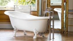 Cast iron bathtub in the bathroom interior