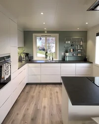 Dark floors and light walls in the kitchen interior