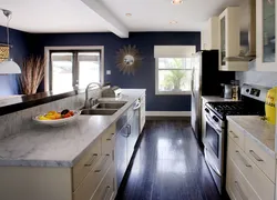 Dark floors and light walls in the kitchen interior