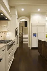Dark floors and light walls in the kitchen interior