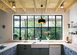 Photo of a kitchen with a loft style window