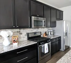 Kitchen design with black splashback