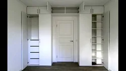 Wardrobe around the door in the hallway photo