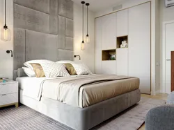 Gray soft bed in the bedroom interior