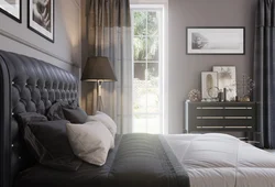 Gray soft bed in the bedroom interior