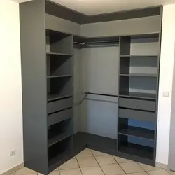 Corner wardrobe in the bedroom design