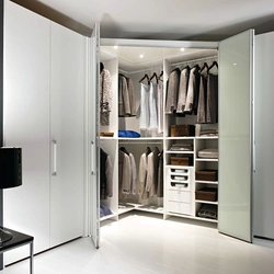 Corner wardrobe in the bedroom design