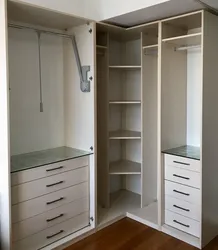 Corner wardrobe in the bedroom design