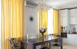 Yellow curtains in the kitchen interior photo