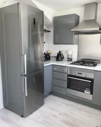 Kitchen with gray refrigerator photo