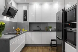 Kitchen with gray refrigerator photo