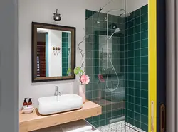 Photo of a bathroom with a toilet and a shower corner