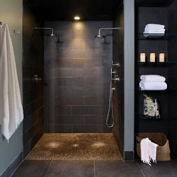 Photo of a bathroom with a toilet and a shower corner