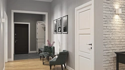 Photo of a hallway with a gray door