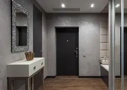 Photo of a hallway with a gray door