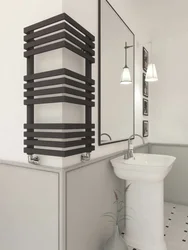 Black heated towel rail in the bathroom design