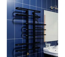 Black heated towel rail in the bathroom design