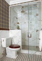 Photo of a tiled shower in a small bathroom