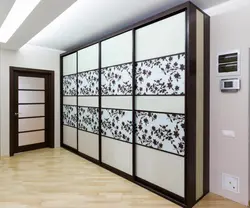 Built-in compartment doors in the hallway photo