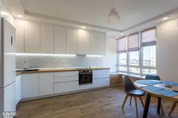 Corner White Kitchen With Wooden Countertop Photo In The Interior