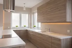 Corner white kitchen with wooden countertop photo in the interior