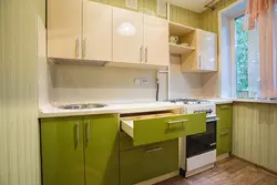 Green kitchens with beige interior photo