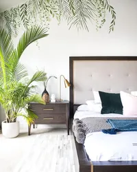 Palm leaves in the bedroom interior