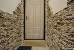 Door in the hallway made of stone photo