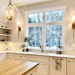 Photo of a bright kitchen with a window in the house