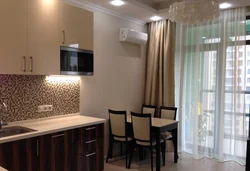 What color are the curtains for a beige kitchen photo