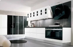 Kitchen with white appliances in the interior photo