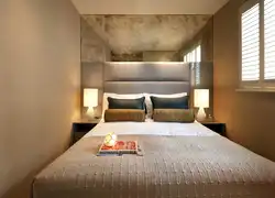 Photo of a small bedroom with a bed