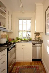 Design of a narrow kitchen in a house with a window