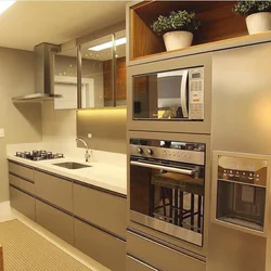 Photo of a built-in kitchen in an apartment with appliances