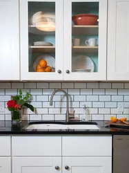 Photo of white tiles with black grout in the bathroom