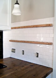 Photo of white tiles with black grout in the bathroom