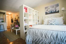 Room in a studio apartment with a bed photo