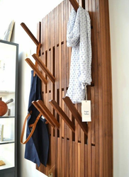 Clothes Hangers In The Hallway Made Of Wood Photo