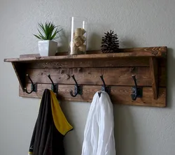 Clothes hangers in the hallway made of wood photo